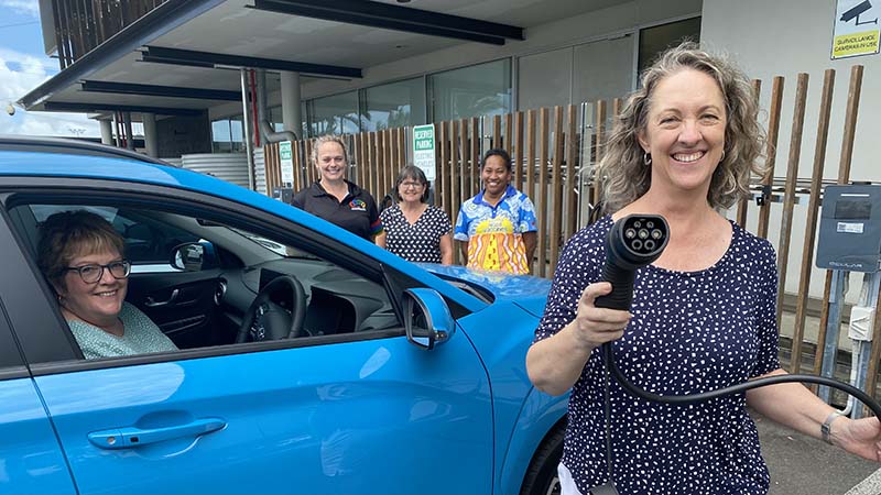 Cairns North Community Health Centre clinicians Julie-Ann Douglas (foreground) with Mary Spencer (inside car), and (back, L-R) Nicole Sporne, Julie Rees and Elsie Mullings are excited about being able to use electric vehicles within the Cairns and Hinterland Hospital and Health Service fleet.
